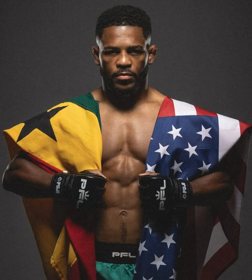 Archie Colgan with Ghana and United States flags