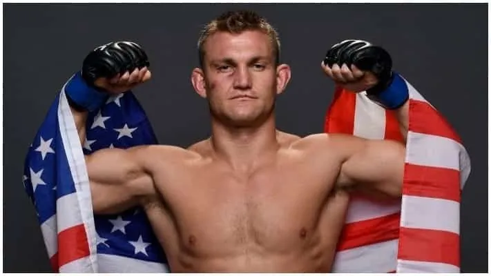 Ian Heinisch with an American flag