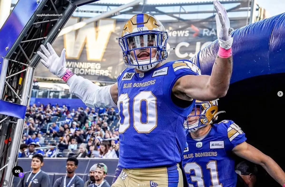 Les Maruo entering the field with the Winnipeg Blue Bombers